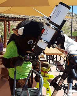 NPS Buddy Bison looks through the scopes